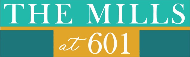 A sign that says "The Mills at 601" in white text on a blue and yellow background.